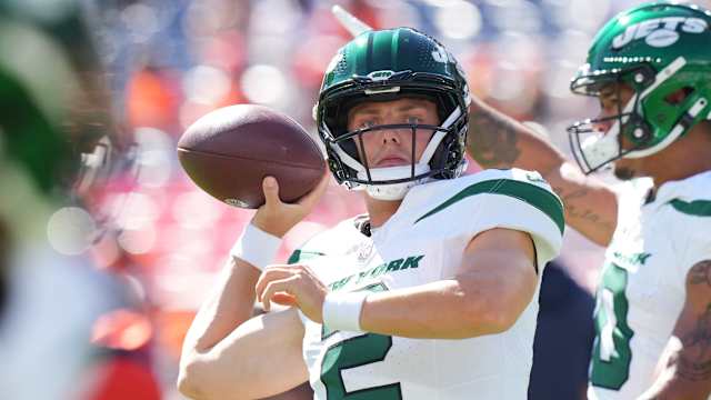 Jets' QB Zach Wilson (2) warms up in Denver